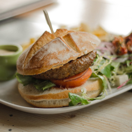 Healthy grilled veggie burger with arugula recipe provided by Wild Workouts & Wellness Milwaukee.